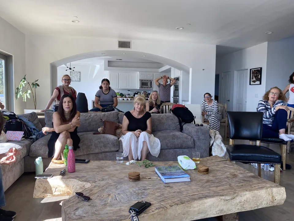 A group gathered in a sunlit living room